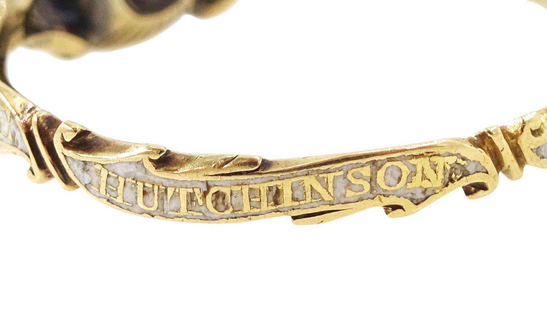 George II 18ct gold amethyst and enamel mourning ring, single cushion cut amethyst, with foiled and glazed back, to pierced fleur-de-lis shoulders, the white enamelled shank engraved Grace Hutchinson OB: 13 Dec: 1756