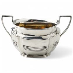 Late Victorian silver three piece tea set of panel sided oval design, the teapot with ebonised handle and lift, Chester 1898/99 Maker Florence Warden and William Aitken