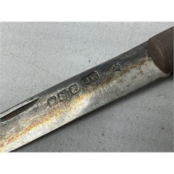 Silver mounted dressing table mirror, embossed with birds, masks, and foliate and C scrolls, hallmarked Birmingham, and fruit knife with mother of pearl handle and silver blade, (2)