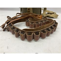 Mundial Brazil bowie knife, the 15.5cm steel blade inscribed 'Sheriff Knife', with banded and aluminium hilt; in leather sheath L29cm overall; British Army felt covered metal water bottle with webbing strap; leather 12-bore cartridge belt; and small pair of non-military binoculars in part case (4)