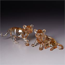 Swarovski, Endangered Wildlife, Tiger and two cubs, each with box, together with glass stands 