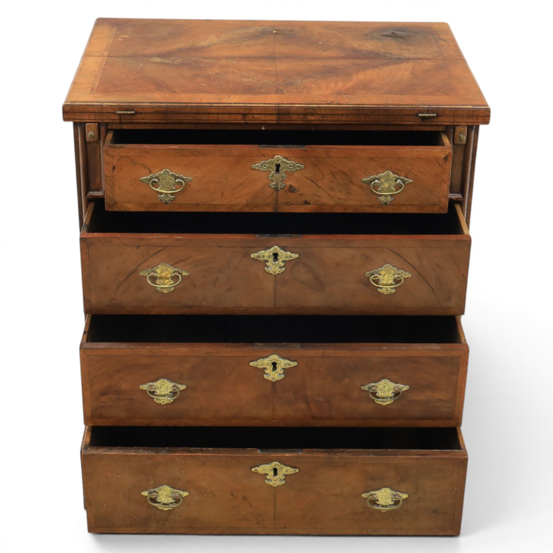 Early 20th century Georgian design figured walnut bachelor's chest, with half fold over top and lopers, over three drawers with pierced brass handles and escutcheons 