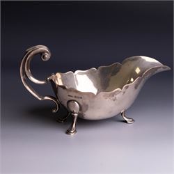 1930s silver sauceboat, of typical form with shaped rim and flying C scroll handle, upon three stepped feet, hallmarked Collingwood & Sons Ltd, Sheffield 1938