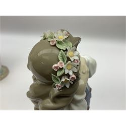 Three Lladro figures, comprising, Dreams of Summer Past no 6401, Spring Breeze no 4936 and Breezy Afternoon 5682 together with Lladro plaque Art Brings us Together no 7677, all in original boxes, largest example H35cm