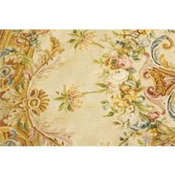 20th century French Aubusson style circular carpet, cream ground of Savonnerie design with scrolling floral and scallop motifs