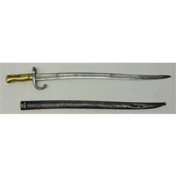  French Sword/Bayonet, 57cm recurve part fullered single edge blade engraved on spine with date 1872 quillion stamped R 84187, ribbed brass grip, steel scabbard stamped U 52, U5913, L71cm  