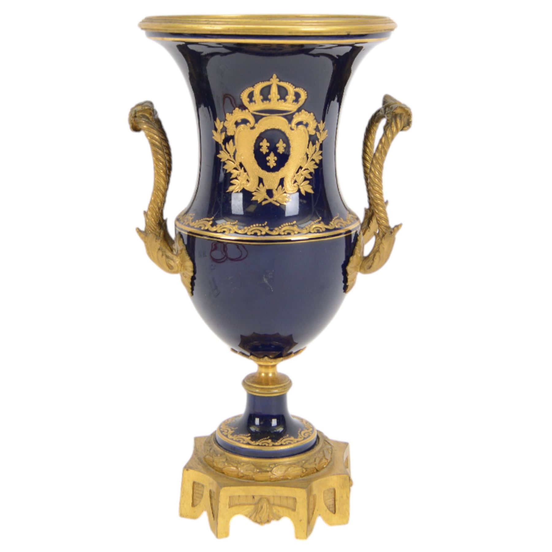 19th century Sevres style ormolu mounted porcelain twin handled urn, the body decorated with a gilt crowned crest of three fleur de lis against a cobalt ground, with spurious Sevres mark beneath, H26cm
