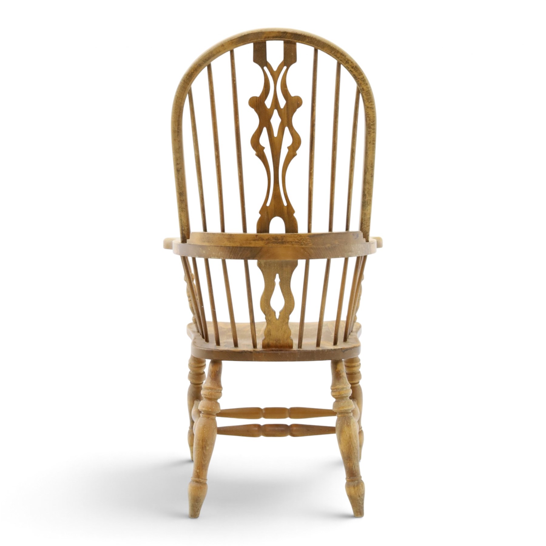 Traditional elm Windsor armchair, hooped spindle back with pierced splat, shaped elm seat, on turned supports united by double H stretcher, turned supports
