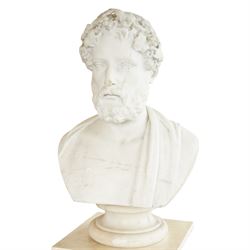 Aristide Louis Fontana (Italian 1834-1907): Grand Tour marble bust of a Roman emperor, probably inspired by portraits of Marcus Aurelius, portrayed with finely carved curled hair and beard beneath a grapevine wreath with trailing vine leaves and clusters of fruit, the draped shoulders and truncated chest raised upon a turned circular socle, signed to the reverse, H61cm; together with the associated faux marble pedestal of rectangular form, H94cm
Provenance: Kirkham Hall
