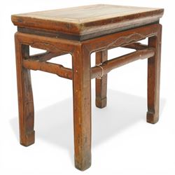 Near pair of 19th century Chinese lacquered elm occasional tables, rectangular top over a bat-motif carved frieze, shaped stretcher rail over tapering supports