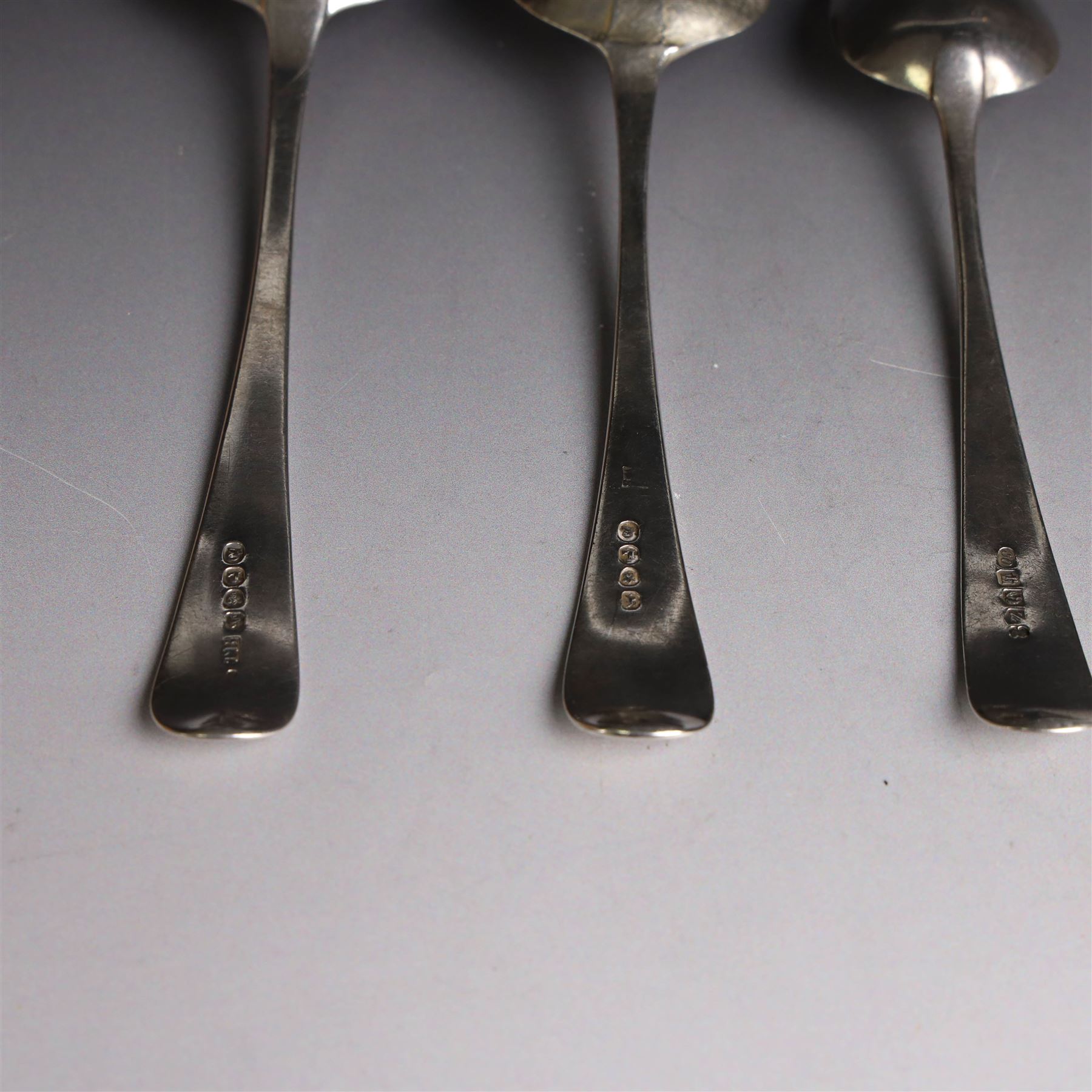 Three George III silver Old English pattern spoons, comprising table spoon with engraved monogram to terminal, hallmarked Thomas Wilkes Barker, London 1806, another table spoon hallmarked London 1806, and a Scottish silver dessert spoon hallmarked James Orr, Edinburgh 1805