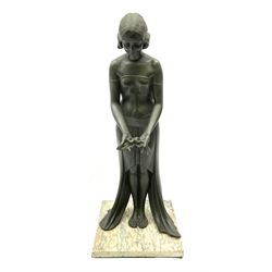 An Art Deco green patinated spelter figure, modelled as a female figure in flowing dress holding a spray of roses, indistinctly signed to dress, possibly 'France', upon onyx base, overall H50cm.