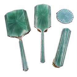 1930's three piece silver mounted and green guilloche enamel dressing table set, comprising hand held mirror, hair brush, and clothes brush, hallmarked Henry Clifford Davis, Birmingham 1937, together with a similar 1930's silver and green guilloche enamel compact, hallmarked Mappin & Webb Ltd, Birmingham 1937, (4)