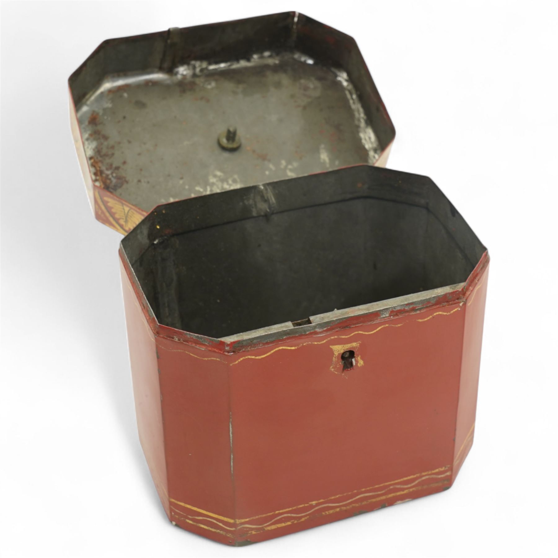 Regency period rare red toleware tea caddy of octagonal from, the cover decorated with a repeating pattern of gilt leaves, with key, H11cm 