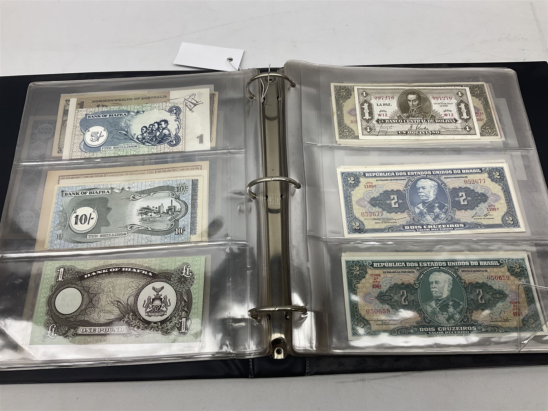 World banknotes, including Queen Elizabeth II The States of Jersey one pound 'DB202703', five pounds 'BB527762' and ten pounds 'AB651481', reserve bank of New Zealand two dollars '1L3 741894', King George V Straits Settlements one dollar 1st January 1935 'F/83 28924', various Bank of England notes etc, housed in two ring binder albums