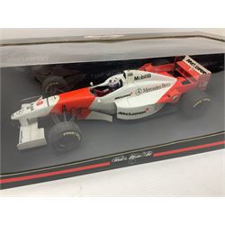 Three Paul's Model Art 1:18 scale die-cast McLaren racing cars - Mercedes MP4/11 D. Coulthard; MP4/4 A. Prost; and Mercedes MP4/10 M. Hakkinen; all boxed (3)