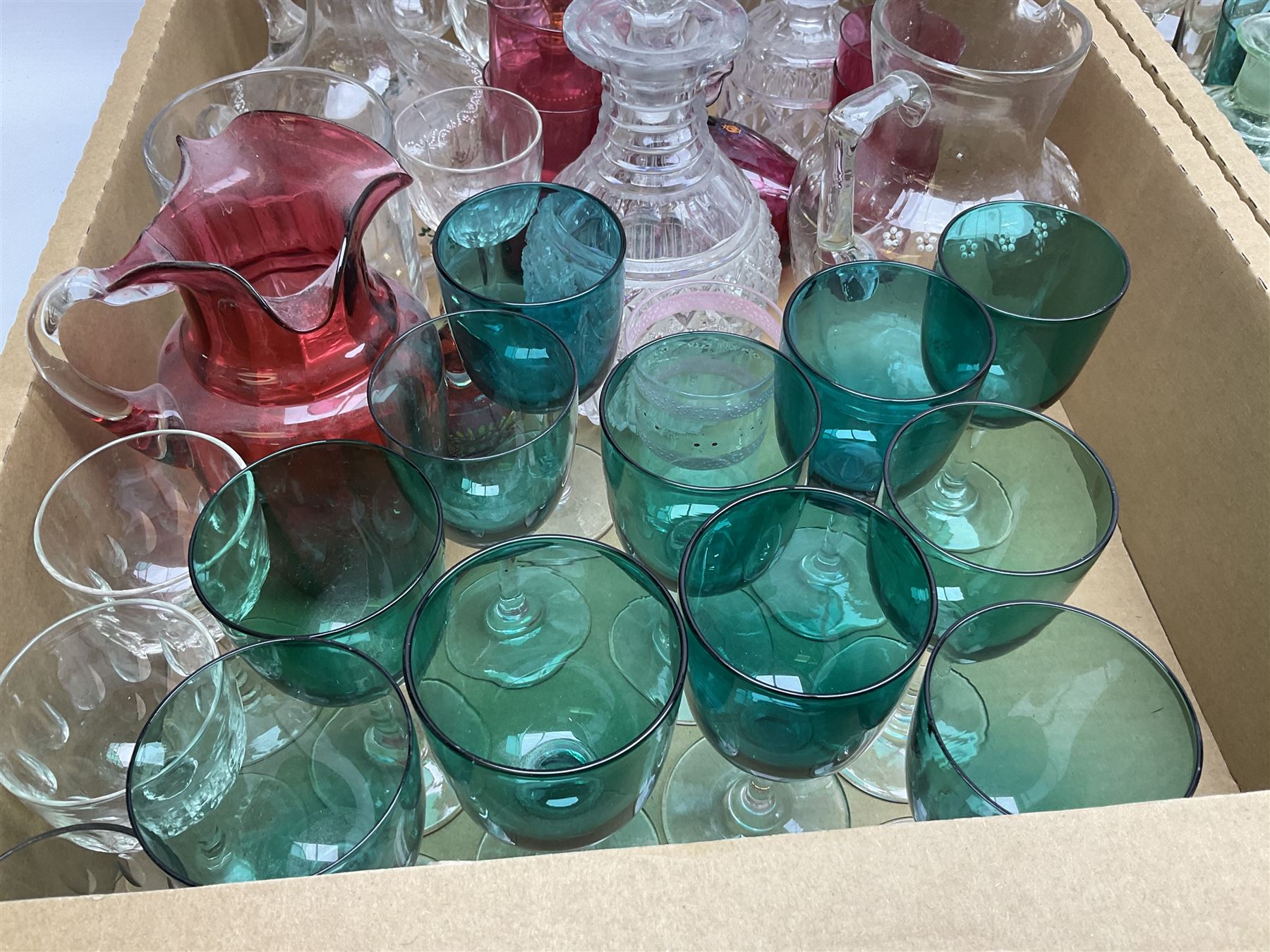 Millefiori paperweight, together with Caithness paperweight, Isle of Wight vase, cranberry glass tumblers, claret jug, decanters and other glassware, in three boxes 