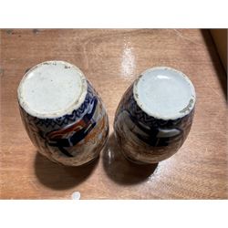 Two Japanese baluster vases decorated in the Imari palette, tallest H19.5cm