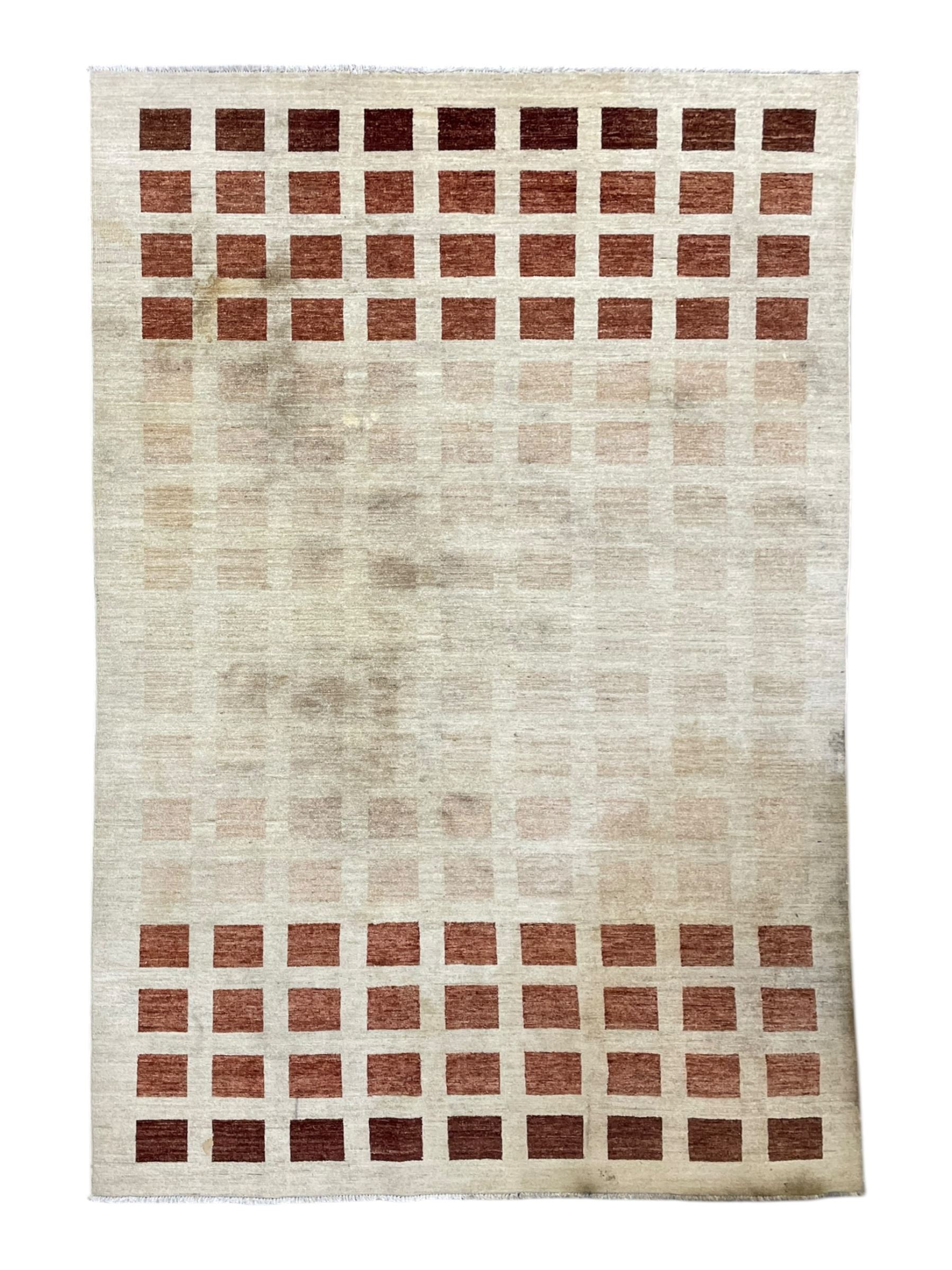 Contemporary camel ground woollen rug, decorated with gradient squares in shades of terracotta 