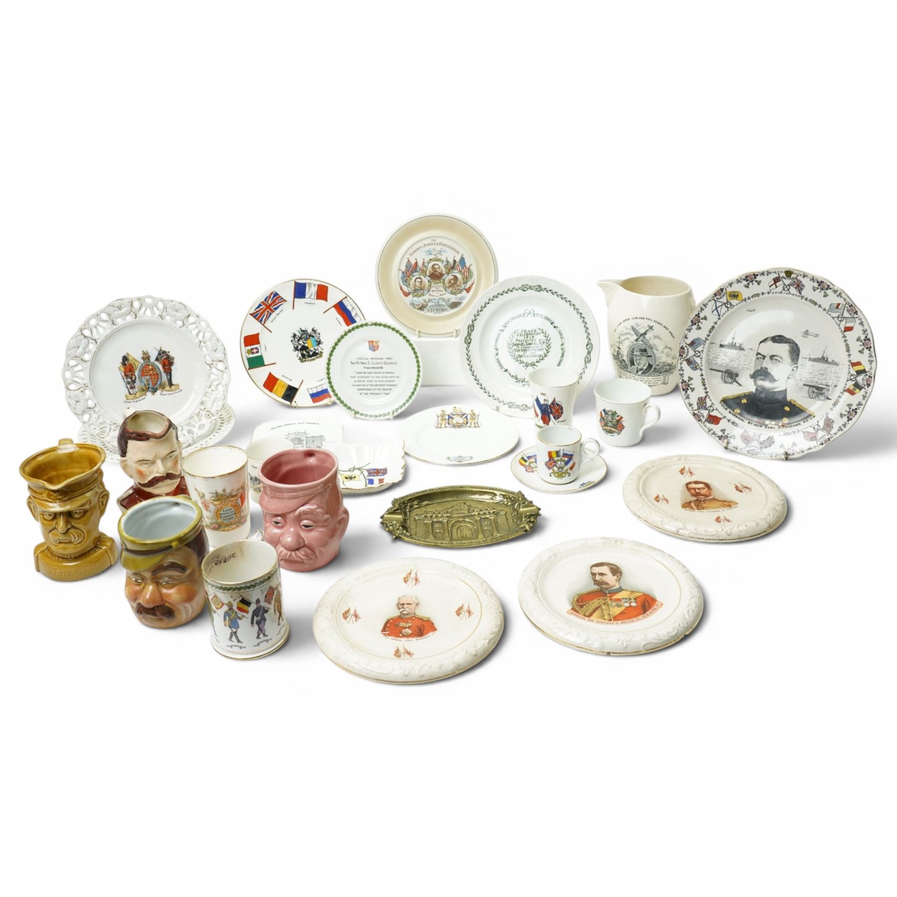 WWI items including Goss plate decorated with WWI allied flags, Grimwades Victory 1918 plate from the Peter Higginc collection, Till & Sons Kitchener plate, Lloyd George plate  inscribed 'Made by the Girls of Staffordshire during the Winter of 1917...'various other plates, beakers and character jugs and a WWII Copeland Spode U.S.A. design Winston Churchill jug