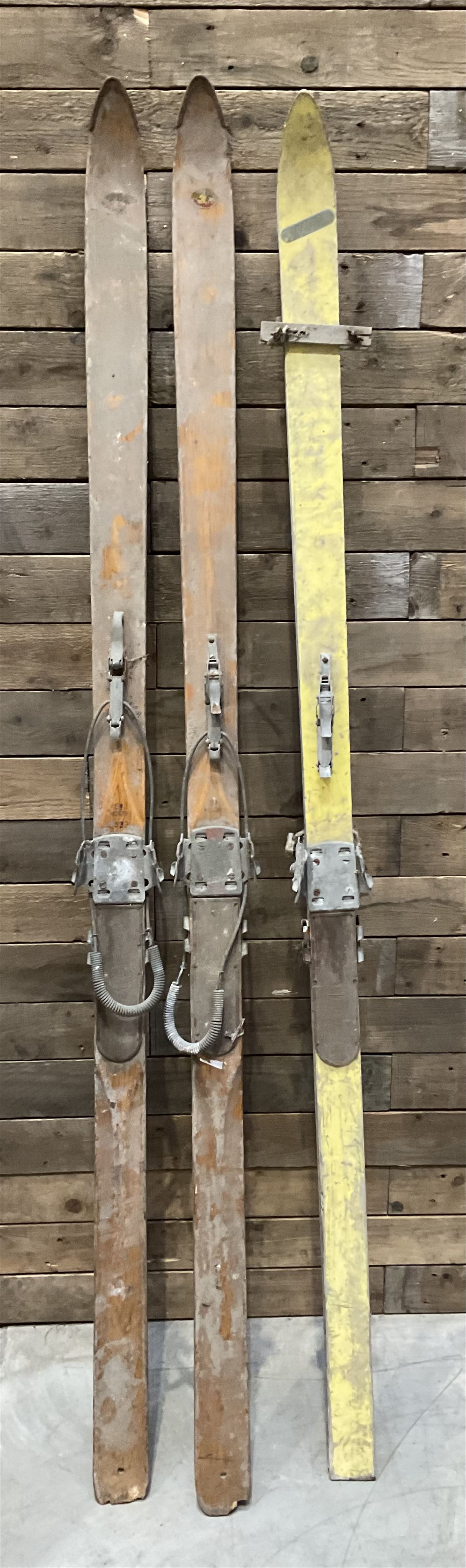 Two pairs of vintage skis, L207cm and 197cm