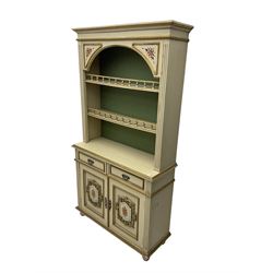 Portuguese painted dresser, two-tier plate rack with spindle gallery, flanked by fluted uprights, fitted with two drawers over two cupboards, the panelled cupboards with floral decoration and a rinceaux border, white painted and parcel-gilt 