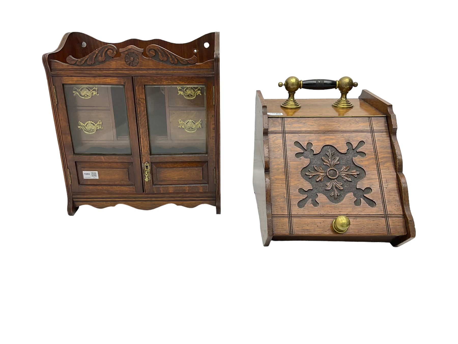 Edwardian oak smokers cabinet, broken swans neck pediment, two bevelled glazed and panelled doors enclosing four small drawers and pigeon hole (W42cm H45cm); Edwardian oak coal scuttle, carved fall-front with brass handles (W32cm H37cm)