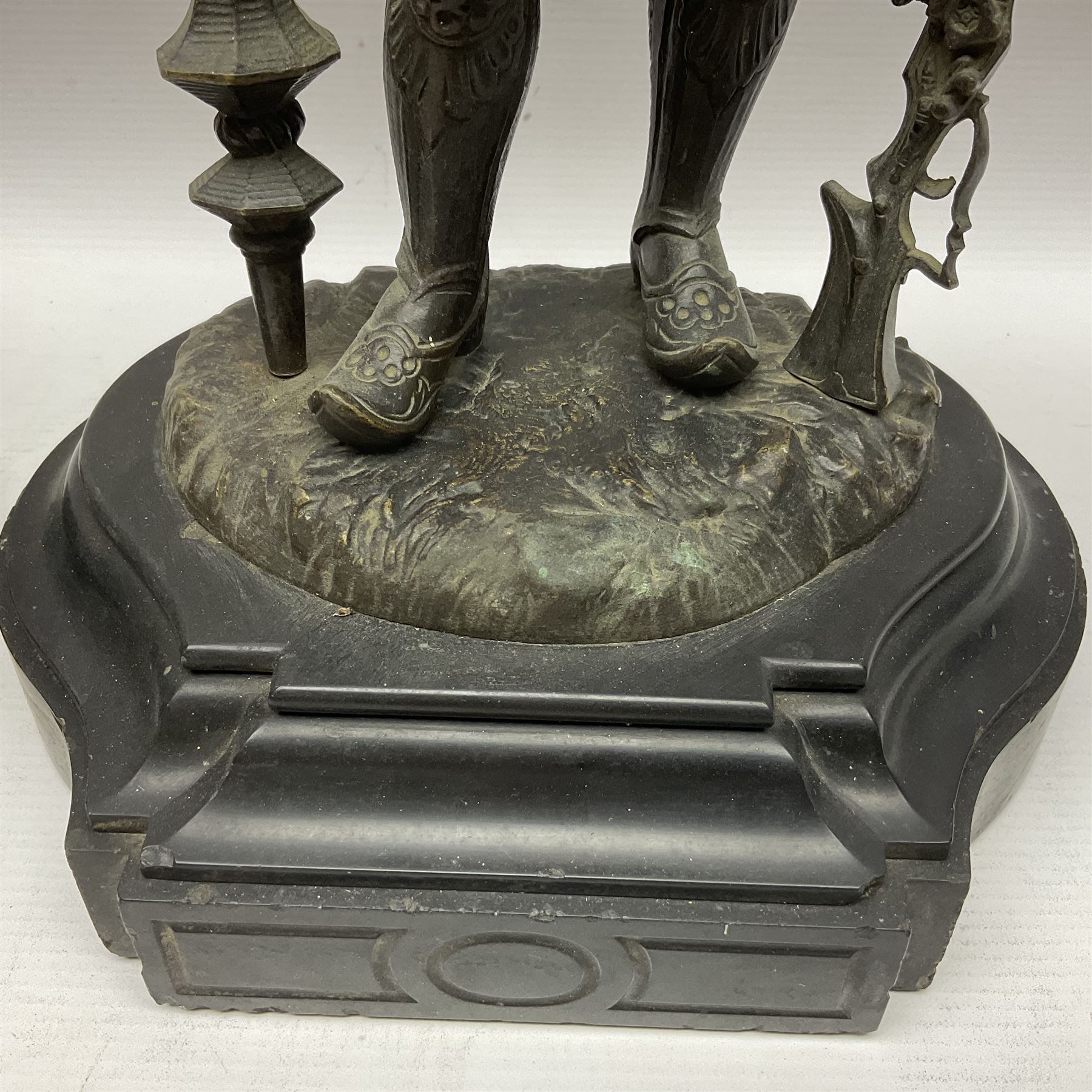 Pair of bronzed figure modelled as a hunter in traditional dress, each holding a pike, H48cm