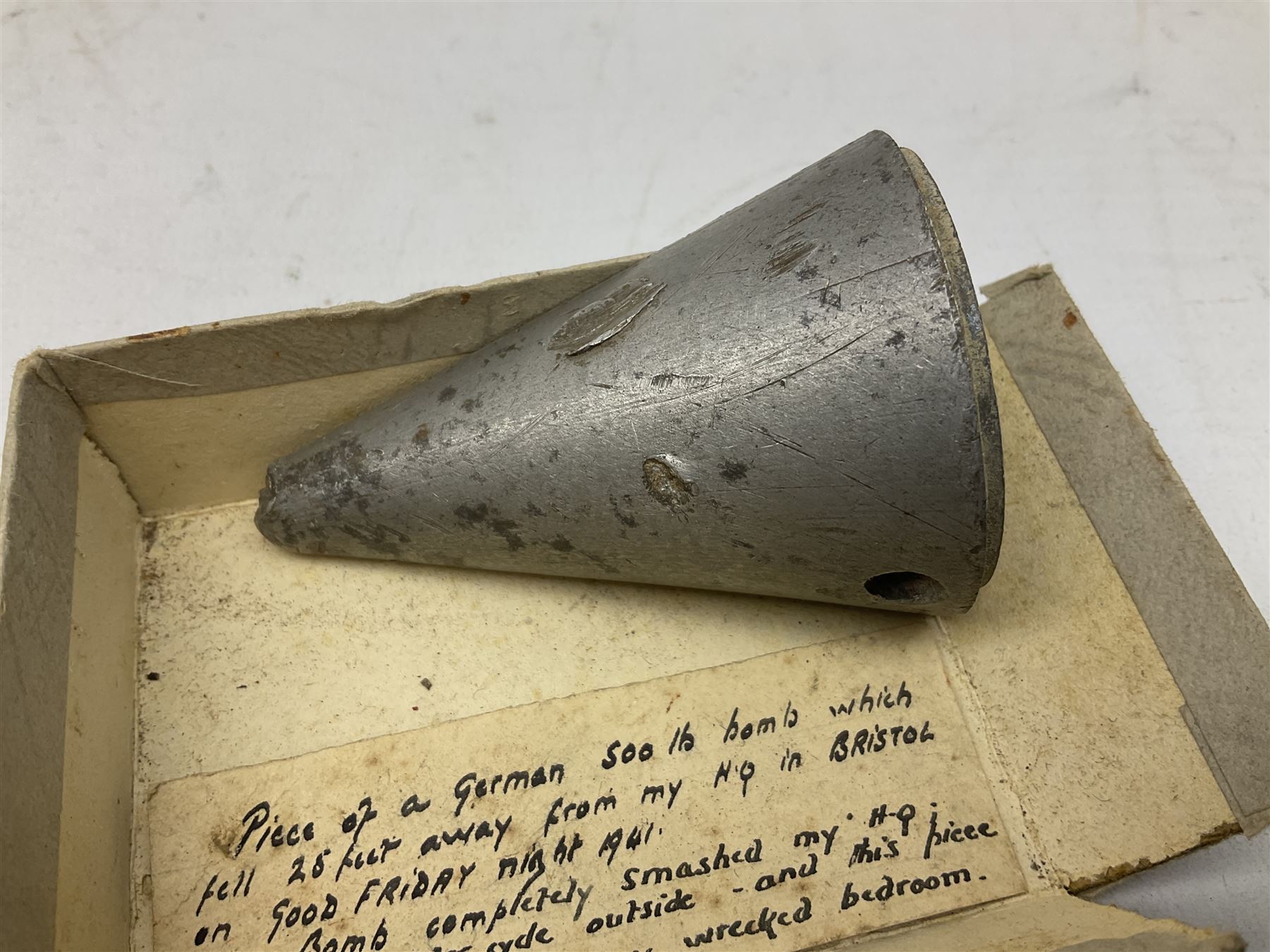 Small collection of WW2 shrapnel and German and British shell parts, most with manuscript details of where and when found including London, Leeds, Bristol, Linton-on-Ouse etc