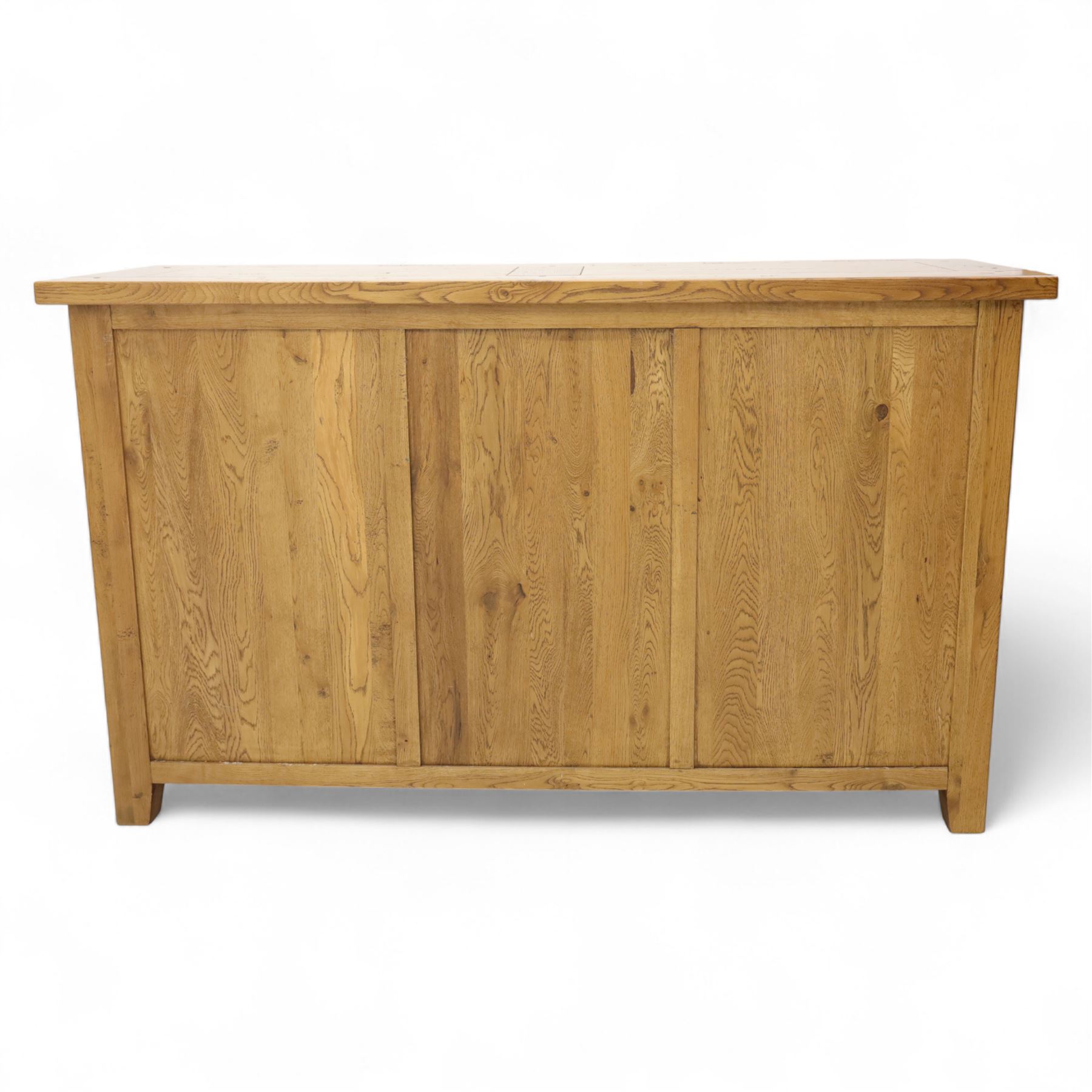 Contemporary solid oak sideboard, rectangular plank top above three drawers and three panelled cupboard doors, fitted with wooden knop handles