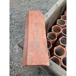 Twenty-seven terracotta land tiles formed as a pyramid shaped wine rack, with wooden box on castors, (L93cm x D62cm x H70cm) - THIS LOT IS TO BE COLLECTED BY APPOINTMENT FROM DUGGLEBY STORAGE, GREAT HILL, EASTFIELD, SCARBOROUGH, YO11 3TX