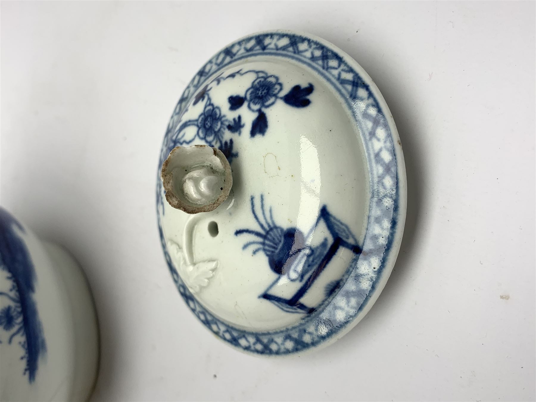 18th Century Worcester teapot, circa 1765-70, decorated in the Bird in the ring pattern, the cover with bud finial, with crescent mark beneath, H13cm, together with a Worcester coffee cup decorated in the same pattern, with crescent mark beneath, H6.5cm