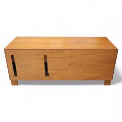 G Plan - 'Fresco' teak side unit, rectangular top above twin cupboard doors and two drawers, drawers fitted with cassette tape storage and a fall front drawer, raised on a plinth base