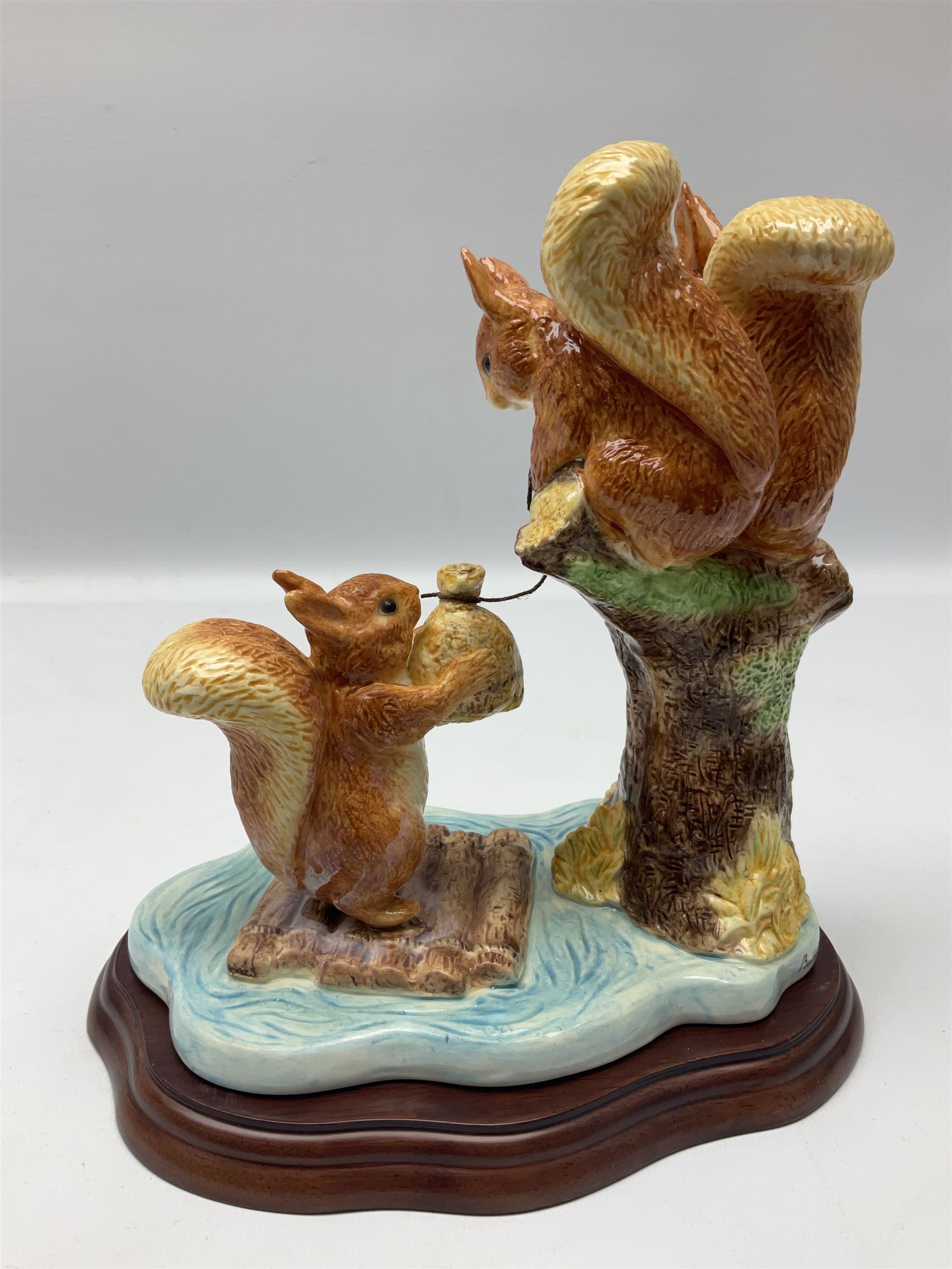 Four Border Fine Arts Beatrix Potter figures, comprising Tableau created to commemorate the Millenium together with a Border Fine Arts Limited Edition no 669814, The Tale of Peter Rabbit Tablet A1306, Four Little Rabbits A2442 and Sailing Home A2443