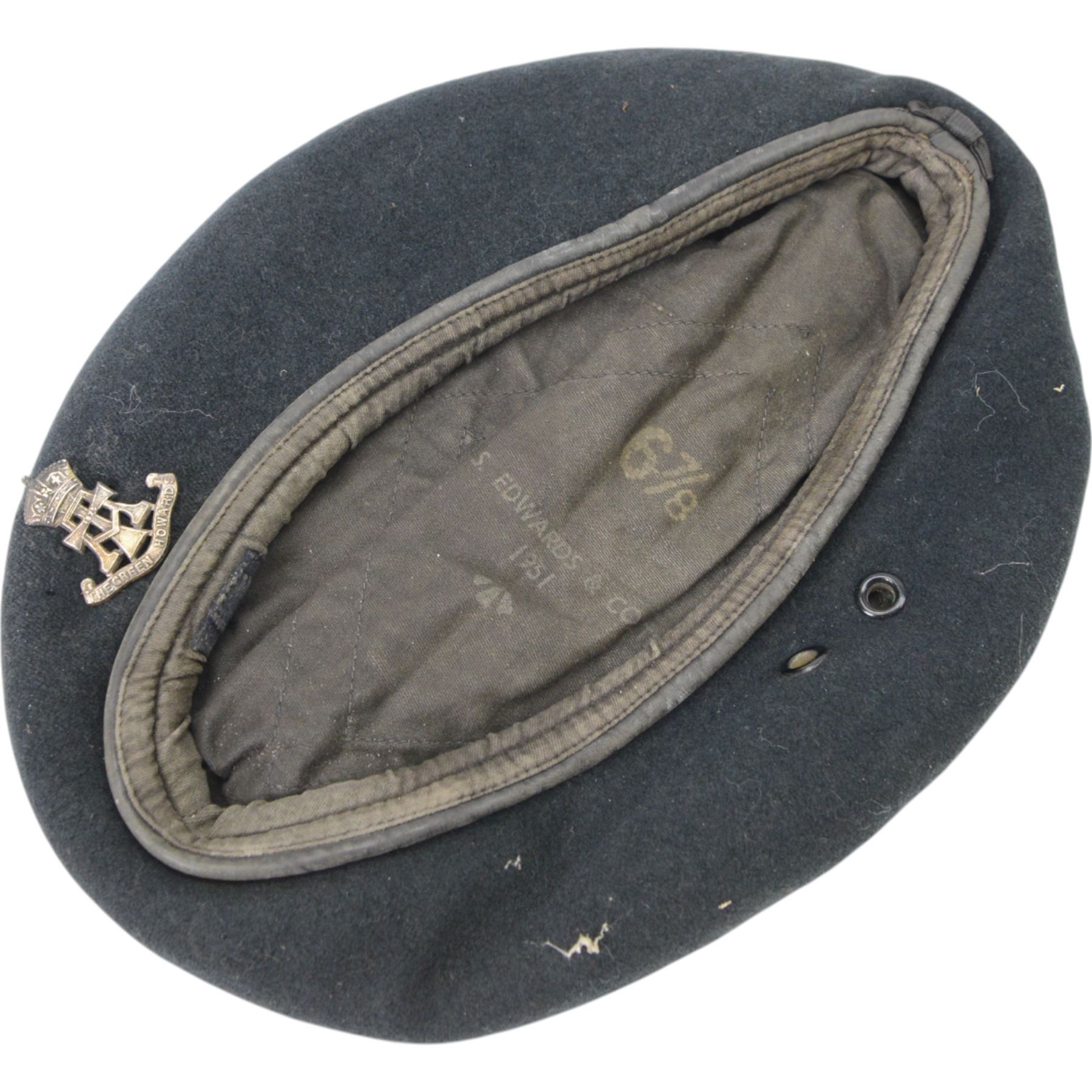 Two British Berets, fine green wool cloth with leather trim, cloth lining having makers details of “BRITISH BERET BASQUE LTD”, one with The Green Howards cap badge, together with other Green Howards buttons and badges, webbing bags and other military items