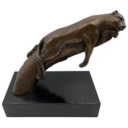 Bronze modelled as a cougar on a branch upon a rectangular wooden plinth, H24cm