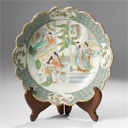 Chinese Kangxi period famille verte bowl, painted with seven figures in a pavilion interio...