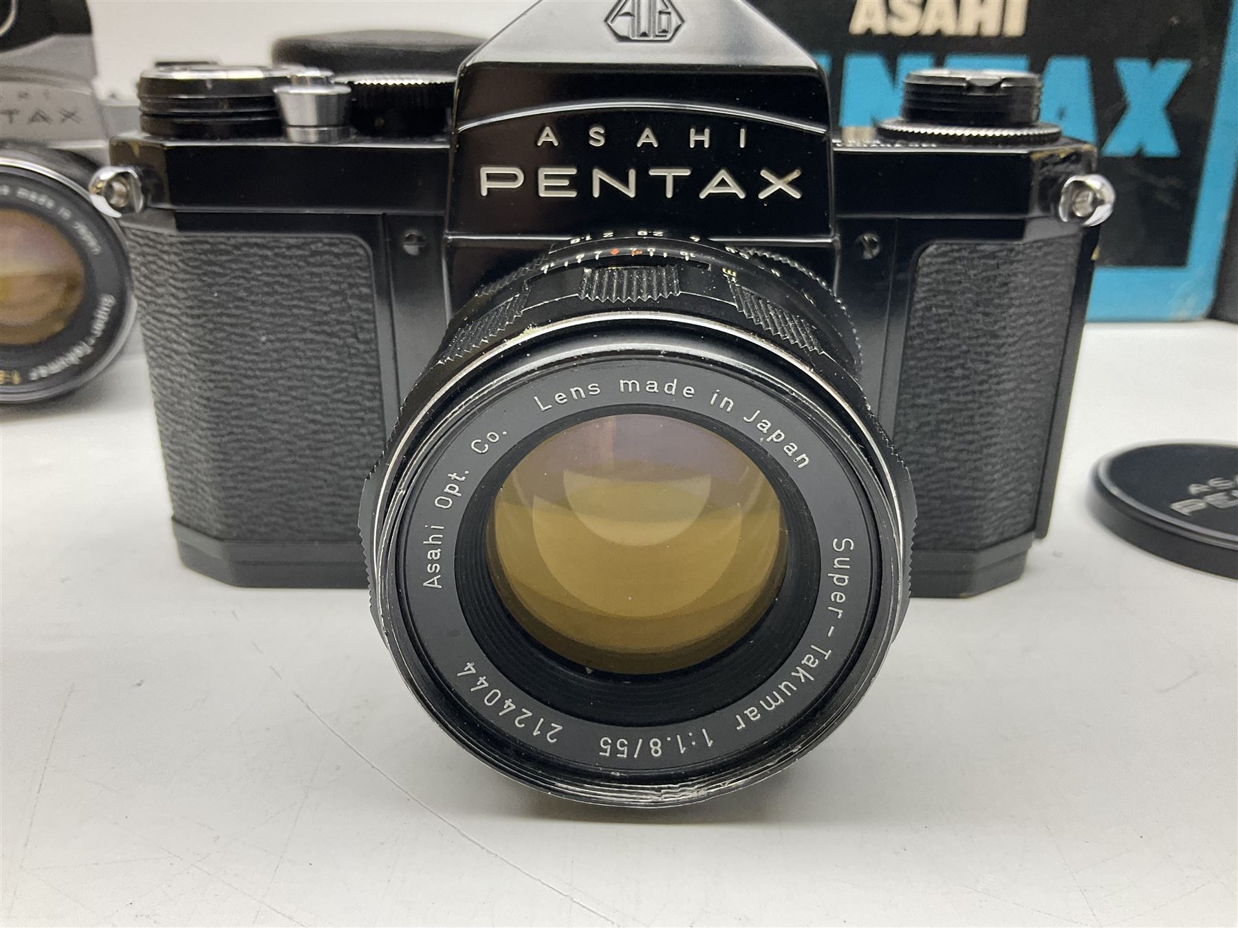 Asahi Pentax S1a camera body, serial no. 707071, with 'Super-Takumar 1:1.8/55' lens, serial no 2124044, together with Asahi Pentax Sv camera body, no. 1925617 with 'Super-Takumar 1:2/55' lens, serial no. 2770153, Asahi Pentax Meter, 'Super-Takumar 1:3.5/28' lens, serial no. 2075492 and 'Super-Takumar 1:4/150' lens, serial no. 1461613  