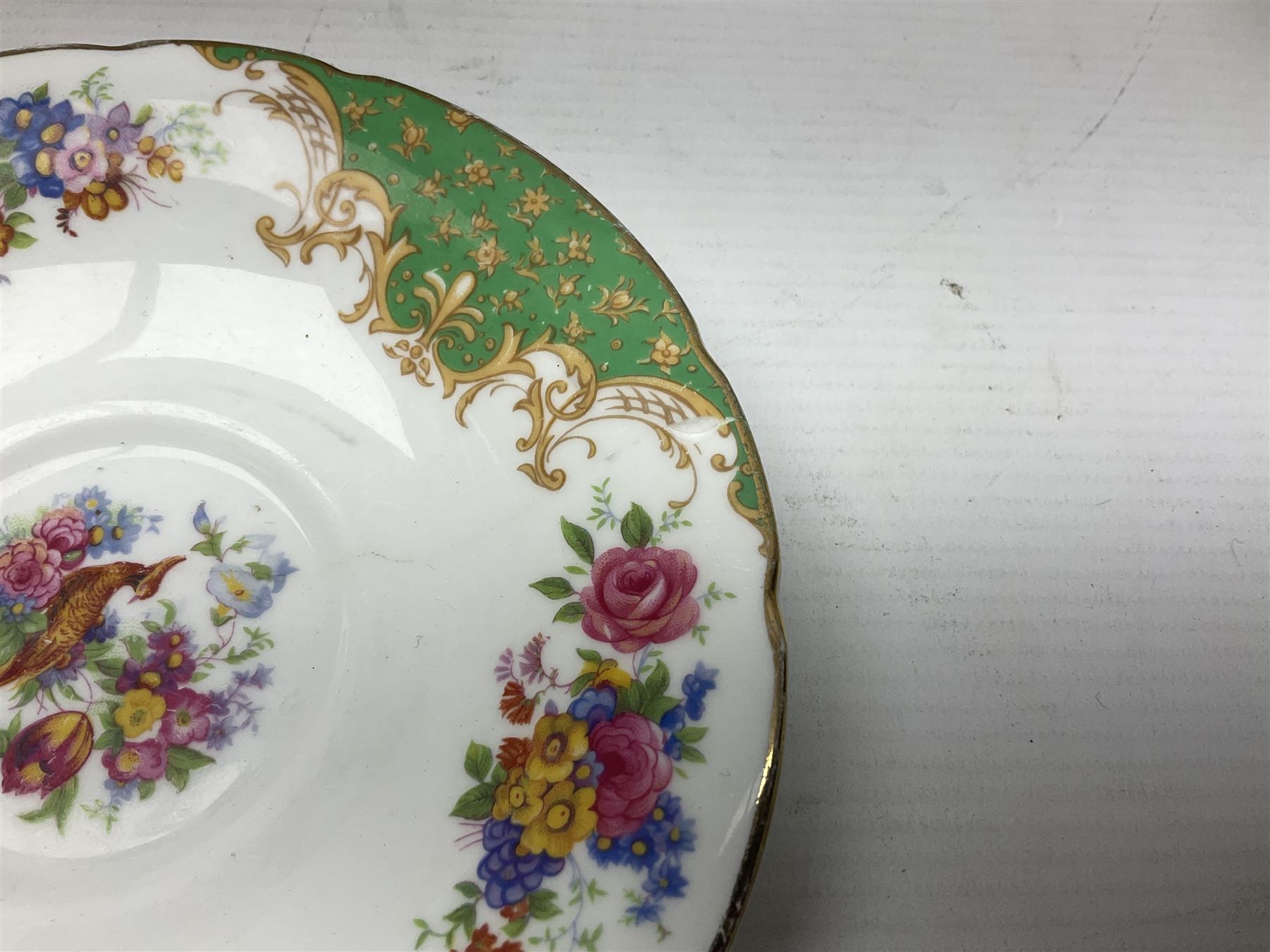 Paragon Rockingham pattern part tea and dinner service including three teapots, milk jug, cups and saucers of various sizes, ten soup bowls, ten side plates, ten dinner plates etc (96)