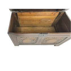 Jacobean Revival - 19th century oak blanket chest, rectangular hinged top, the two front panels carved arched foliate decoration, raised on stile supports