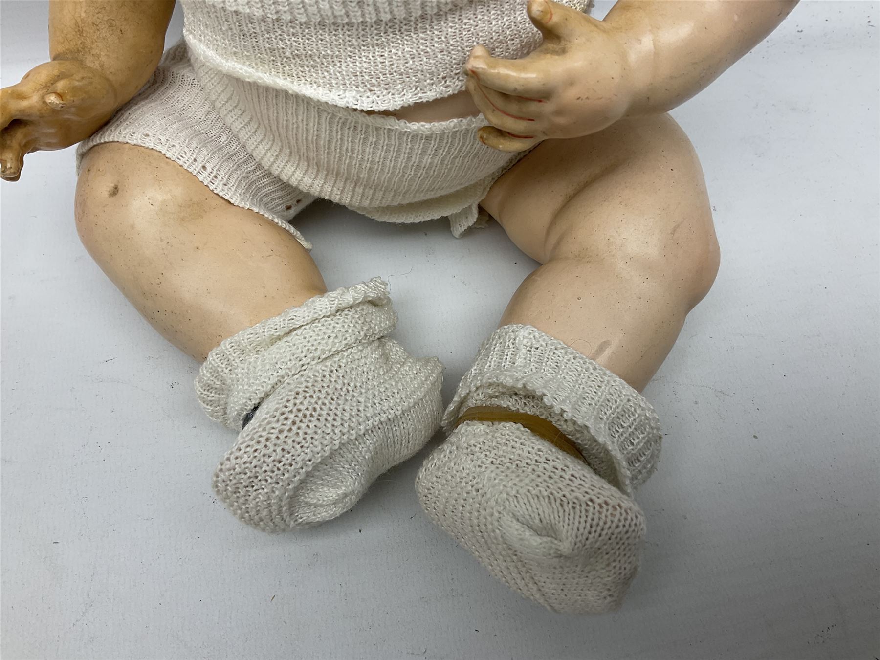 Carl Harmus Germany bisque head doll with applied hair, sleeping eyes, open mouth with teeth and composition body with jointed limbs; marked 'Harmus 313.4/0 Germany' H38cm; and Alt, Beck & Gottschalk Germany bisque head doll with applied hair, fixed eyes, open mouth with tongue and composition body with jointed limbs H44cm (2)