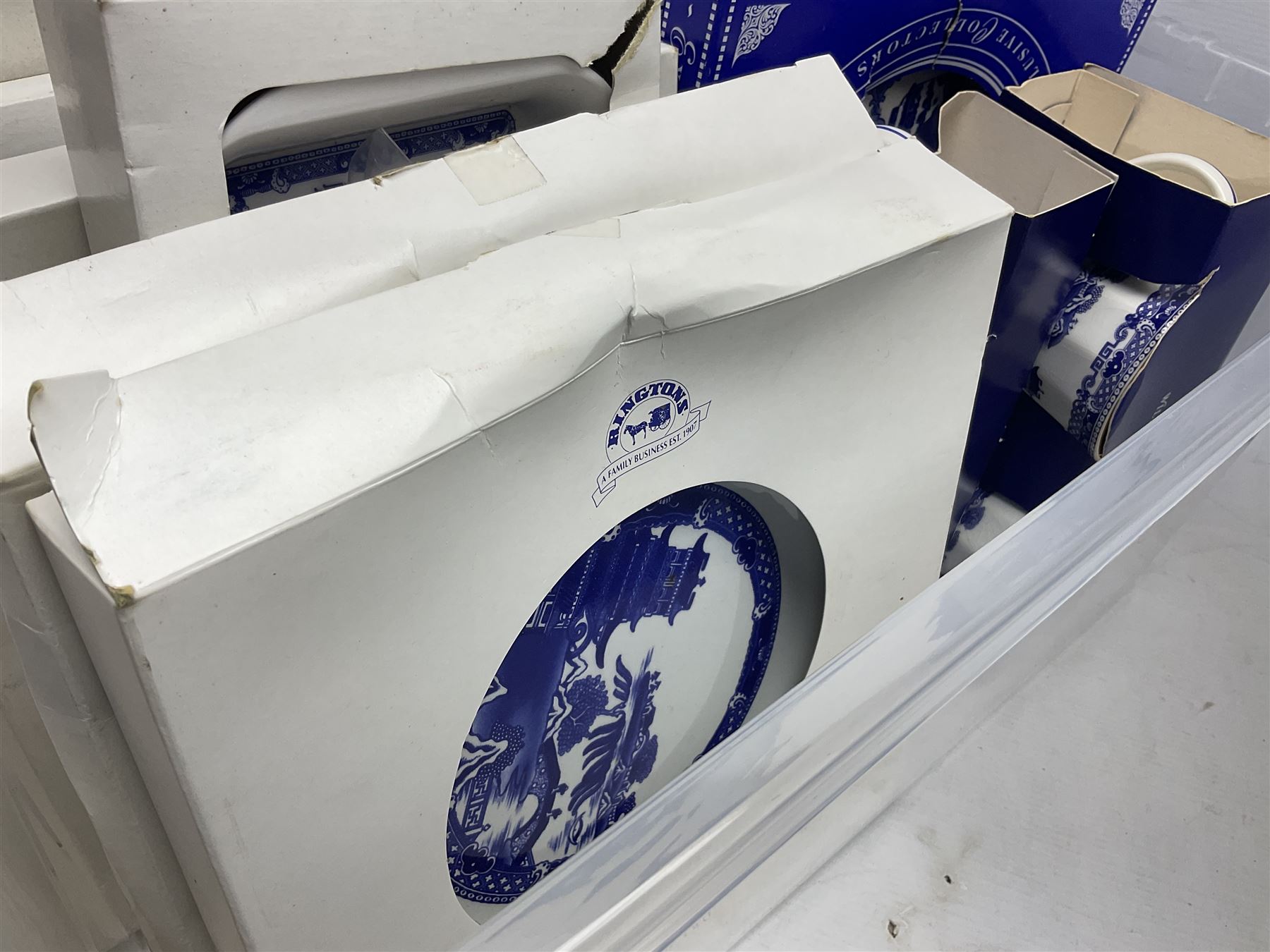 Large quantity of Ringtons blue and white Willow pattern ceramics, to include exclusive collectors examples, dinner plates, teapots, breakfast set, etc, predominantly boxed, four Capodimonte figures comprising example modelled as a girl reading with a puppy, boy giving a bone to a dog, boy reading on cushion and tramp boy sat cross legged with umbrella, together with three The Leonardo Collection figures comprising Midsummer Melody, Alfresco and Butterfly Catchers