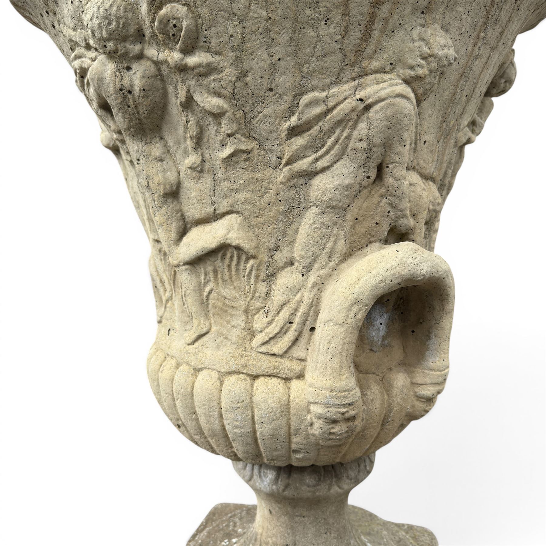 Greek design cast stone garden centre-piece urn, decorated with figures and loop handles, raised on squat pedestal, square base