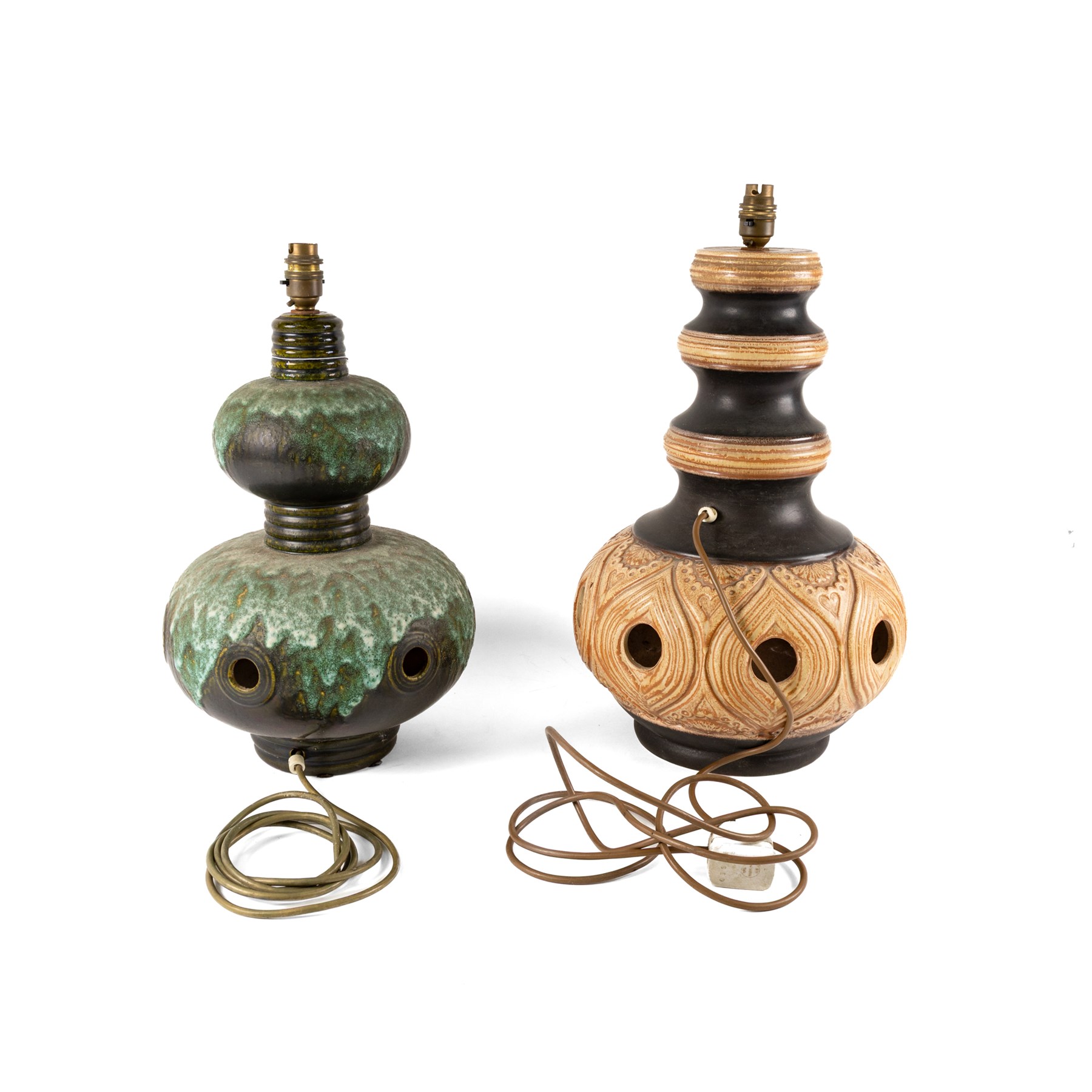 West German Pottery - two mid 20th century ceramic lamp bases, brown glaze with petal style decoration and pierced detail, together with another similar with volcanic glaze, largest H52cm