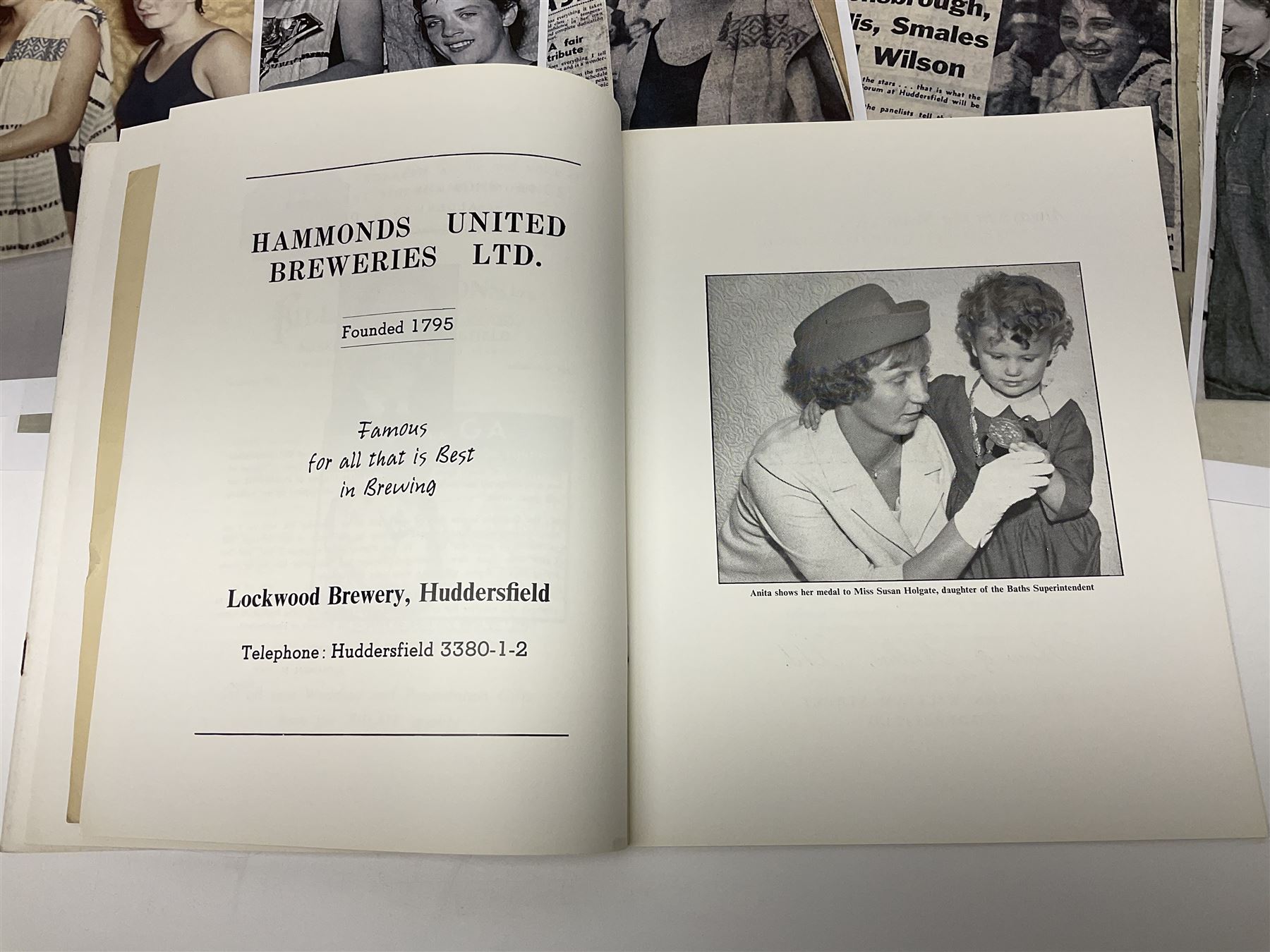 On the direct instructions of Anita Porter nee Lonsbrough Great British Olympic and Commonwealth Games gold medal winning swimmer - collection of early and international memorabilia comprising original Huddersfield Bath Club track suit top bearing eight stitched on cloth badges including British Empire & Commonwealth Games 1958 England Team, YSASA, North Eastern Counties ASA, ESSA Division 3,  English Schools Swimming Association winner etc
The swimming costume Anita wore at the 1958 Commonwealth Games in Cardiff, her first major championships, where she won two gold medals. The grey elastic on the sides, in those days, she would use to make it tighter and more streamlined.
Blue track suit from the 1960 Olympics which she wore on the podium receiving the gold medal.
1960 pool side towelling robe used at the Rome Olympics (interesting to note her name is spelt wrong on the embroidered label).
1962 Commonwealth Games pool side towelling robe used in Perth Australia when winning three Gold medals. 
It was also this year she became BBC Sports Personality of the year, the first female to do so.
Her 'lucky' pool side towel which she took with her to every event she competed in and which can be seen round her neck in many official celebratory photographs. Copies of some of these photographs are included for identification.
In addition there are two souvenir programmes of an evening event to honour Anita at The Theatre Royal Huddersfield and she has kindly signed the front cover on one of these.