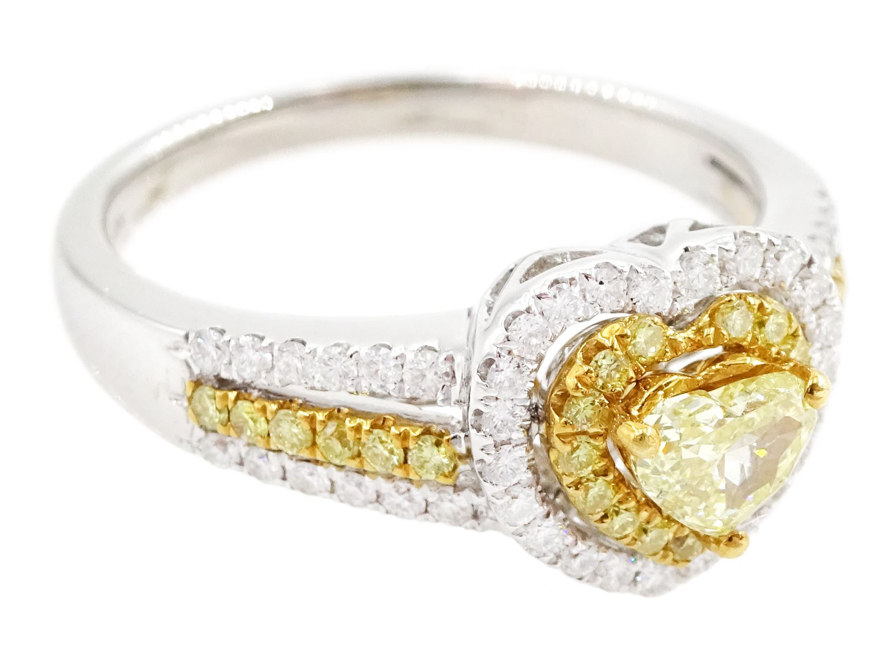 18ct white gold diamond heart cluster ring, principal heart cut fancy yellow diamond of approx 0.25 carat, surrounded by two halos of fancy yellow and white diamonds and split diamond set shoulders, Birmingham 2008, total diamond weight approx 0.50 carat