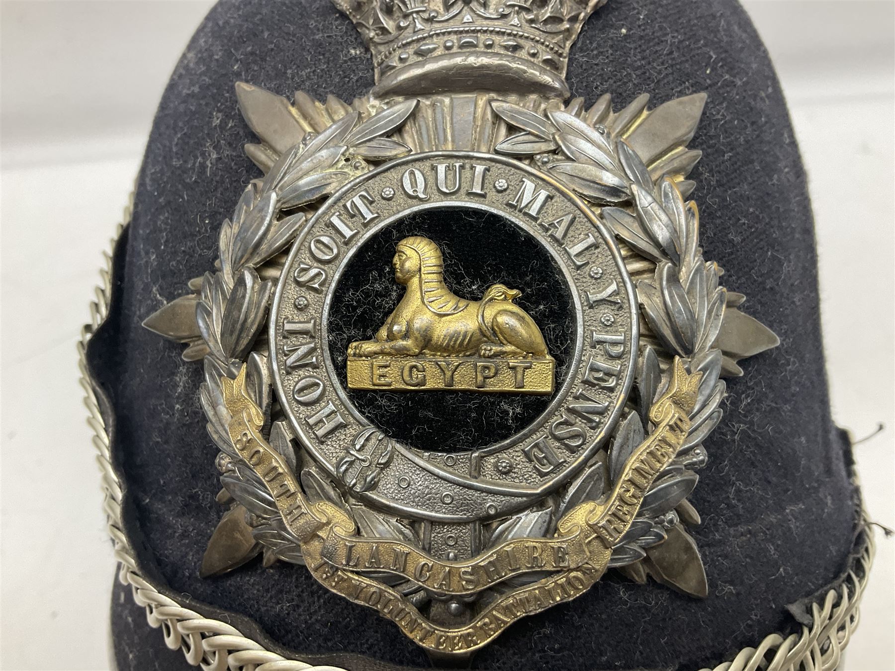 Victorian British Army South Lancashire Regiment 1st Volunteer Battalion other ranks blue cloth home service helmet with helmet plate, spike and chinstrap