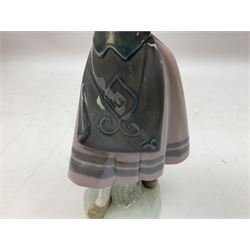 Three Lladro figures, comprising Pondering, no 5173, Nostalgia, no 5071 and Nature's Bounty, no 1417, all with original boxes, largest example H27cm