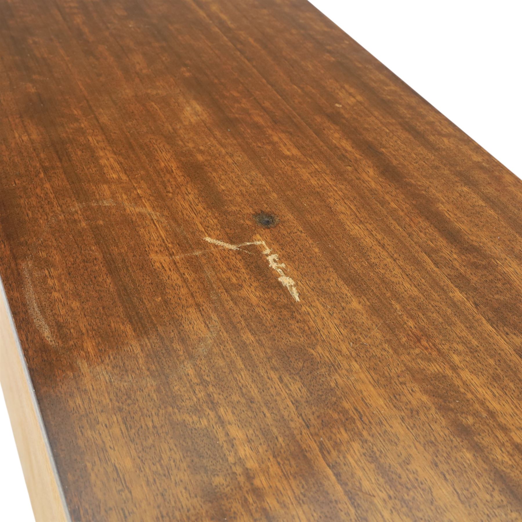 G Plan - ‘Librenza’ tola wood sideboard, the rectangular top above two cupboards to either side and three graduated central drawers, the drawer and door fronts veneered in figured tola wood with brass handles, standing on splayed tapering legs