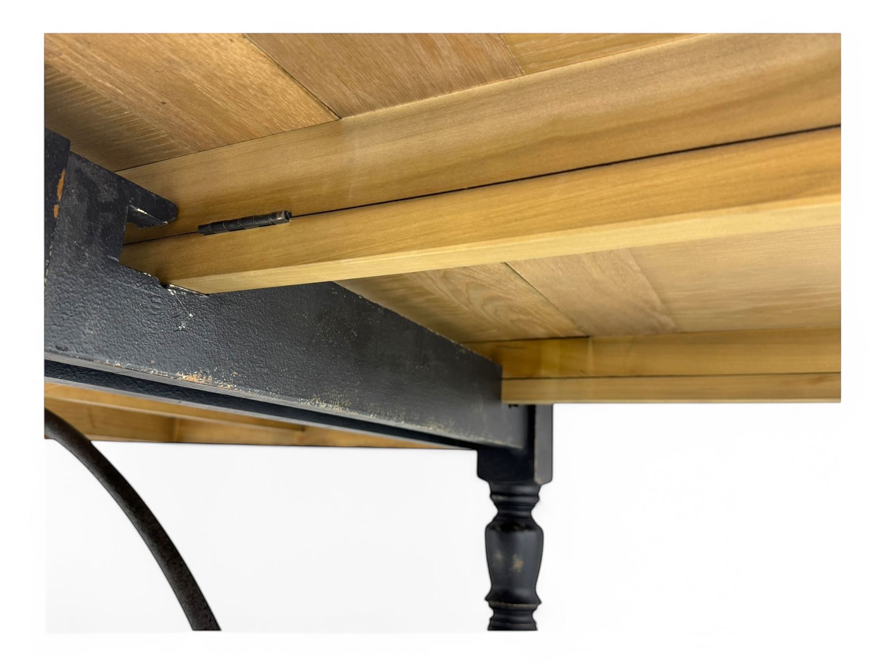 Barker & Stonehouse - large oak extending draw-leaf dining table, rectangular plank top over a black painted base, turned supports joined by shaped stretchers, extending at each end with pull-out leaves